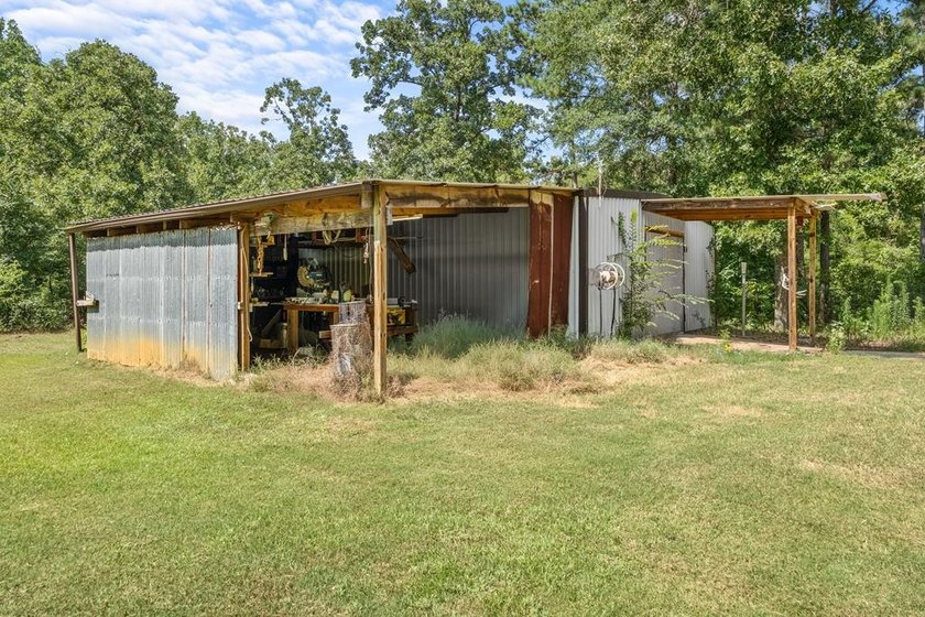 Tucked away among nearly 39 acres of towering timber, this East - photo 31