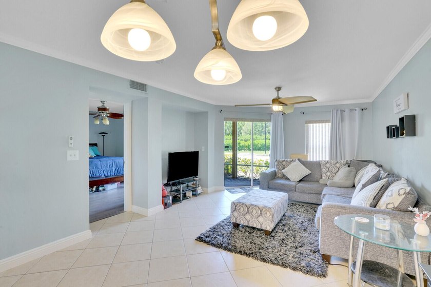 Welcome to this inviting first-floor condo in a gated community - photo 8