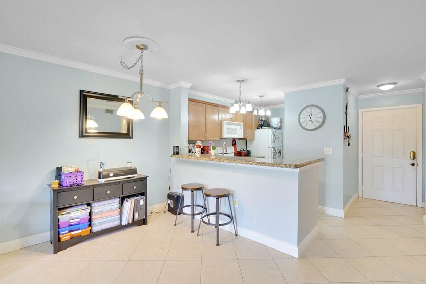 Welcome to this inviting first-floor condo in a gated community - photo 9