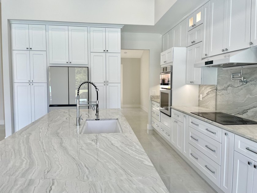 Welcome to this reimagined 4-bedroom, 3-bathroom, pool home in - photo 14