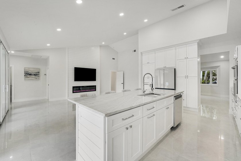 Welcome to this reimagined 4-bedroom, 3-bathroom, pool home in - photo 15