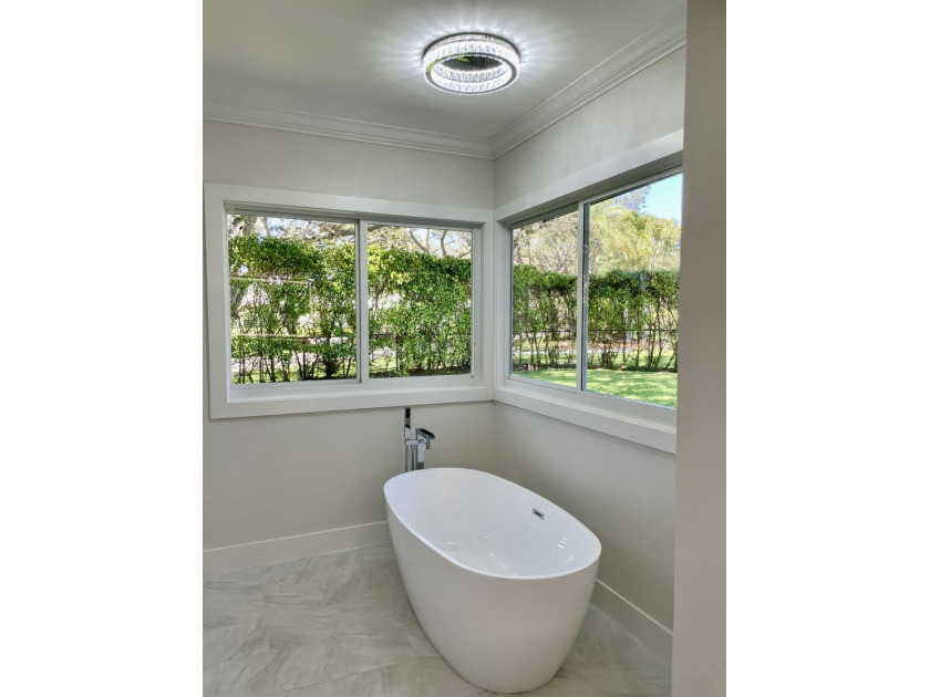 Welcome to this reimagined 4-bedroom, 3-bathroom, pool home in - photo 31