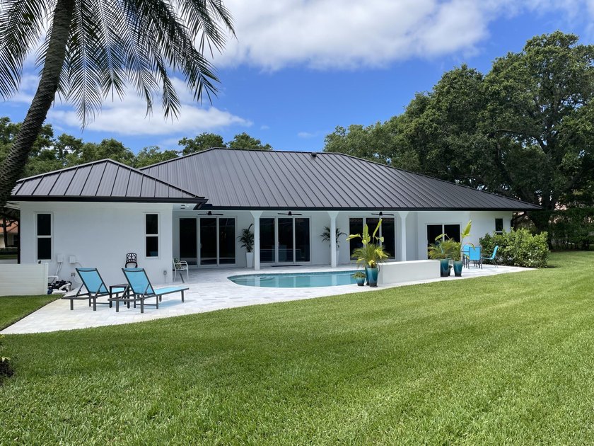 Welcome to this reimagined 4-bedroom, 3-bathroom, pool home in - photo 35