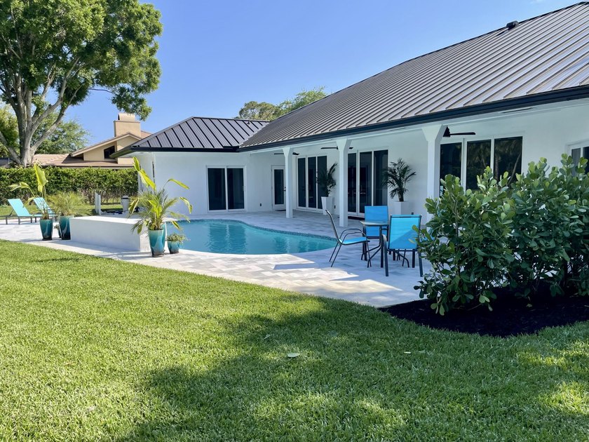 Welcome to this reimagined 4-bedroom, 3-bathroom, pool home in - photo 37