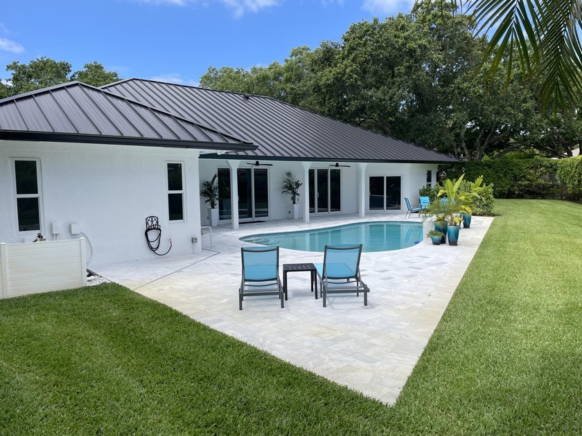 Welcome to this reimagined 4-bedroom, 3-bathroom, pool home in - photo 40