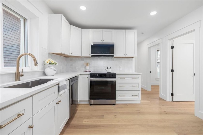 Thoughtfully renovated two-unit multi-family home with an - photo 11
