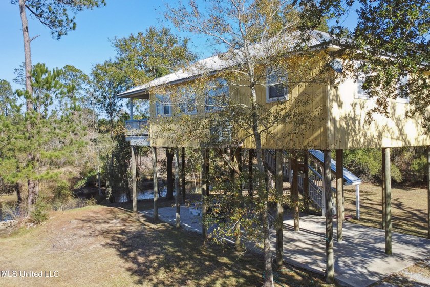 Classic elevated coastal cottages at 10450 MS 603 in Bay St - photo 2
