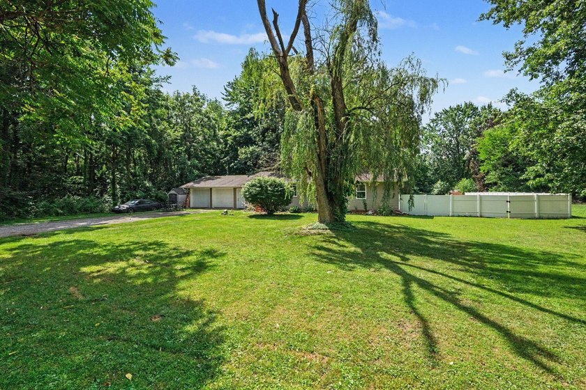 Nestled on 2 beautiful acres, this spacious ranch offers the - photo 2
