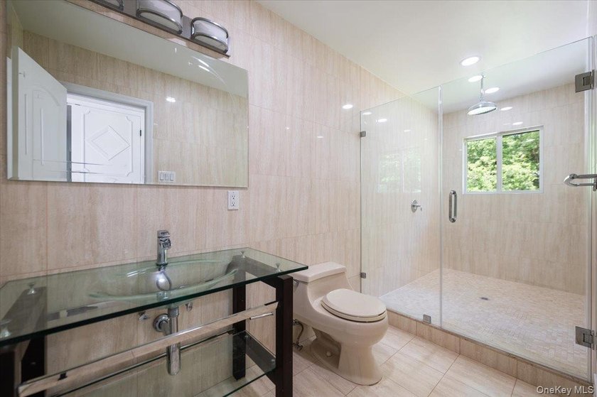 Welcome to this sprawling sunlit ranch with vaulted ceilings and - photo 12