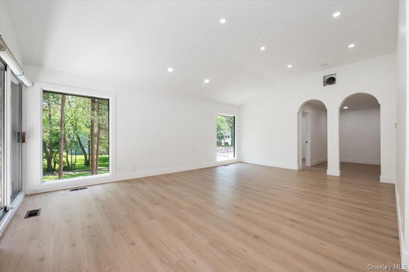 Welcome to this sprawling sunlit ranch with vaulted ceilings and - photo 15