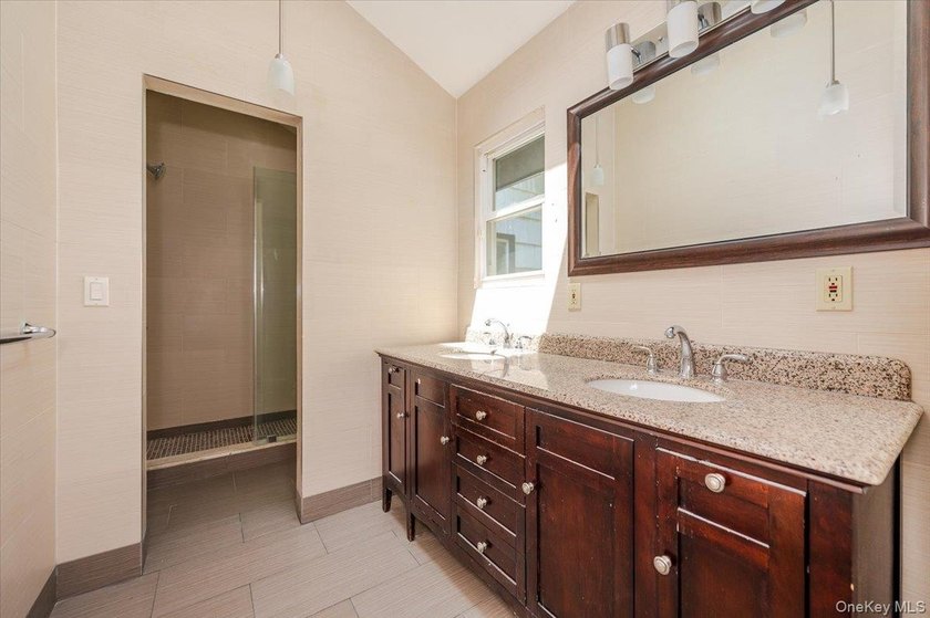 Welcome to this sprawling sunlit ranch with vaulted ceilings and - photo 17