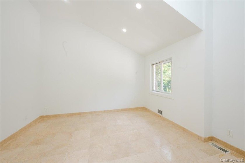 Welcome to this sprawling sunlit ranch with vaulted ceilings and - photo 20