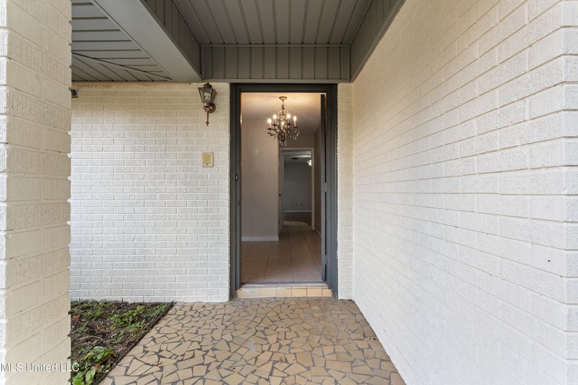This well-maintained 4-bedroom, 2-bath brick home is situated on - photo 5