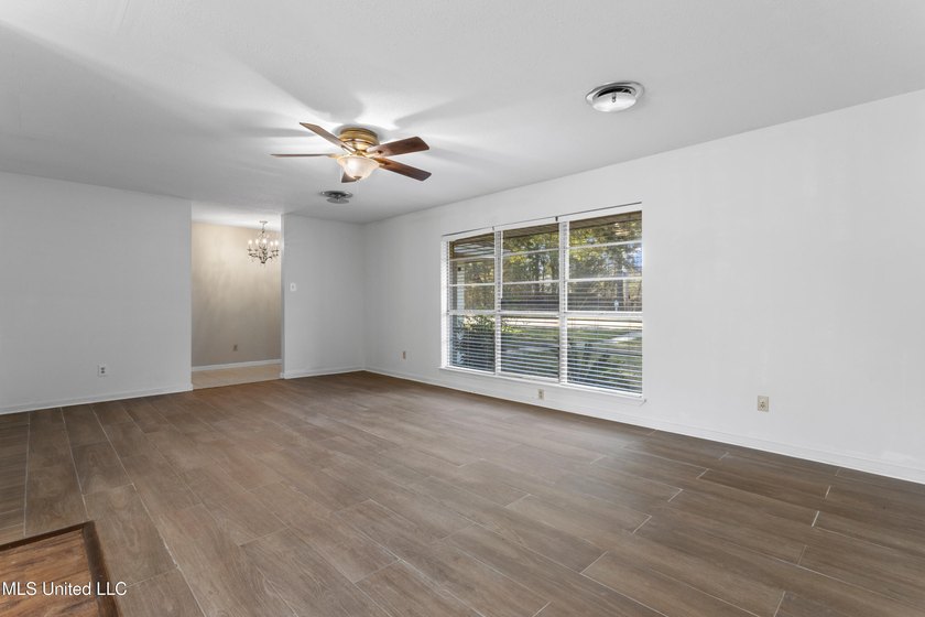 This well-maintained 4-bedroom, 2-bath brick home is situated on - photo 8
