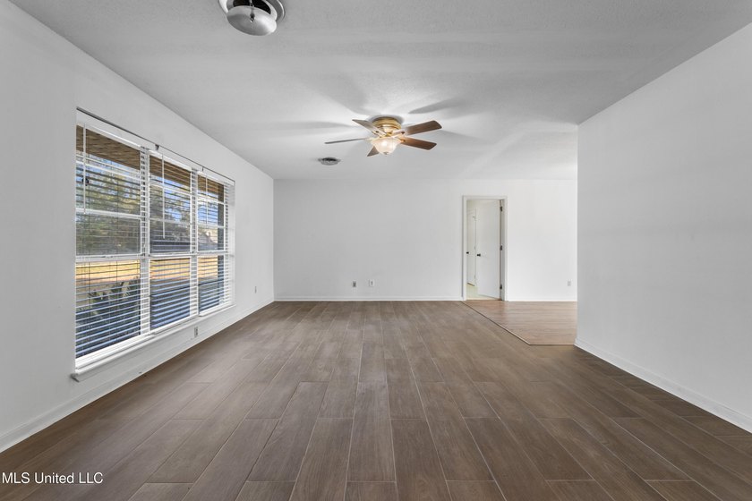 This well-maintained 4-bedroom, 2-bath brick home is situated on - photo 9