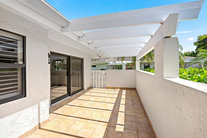 Tucked away in the picturesque Windward Village enclave of - photo 12