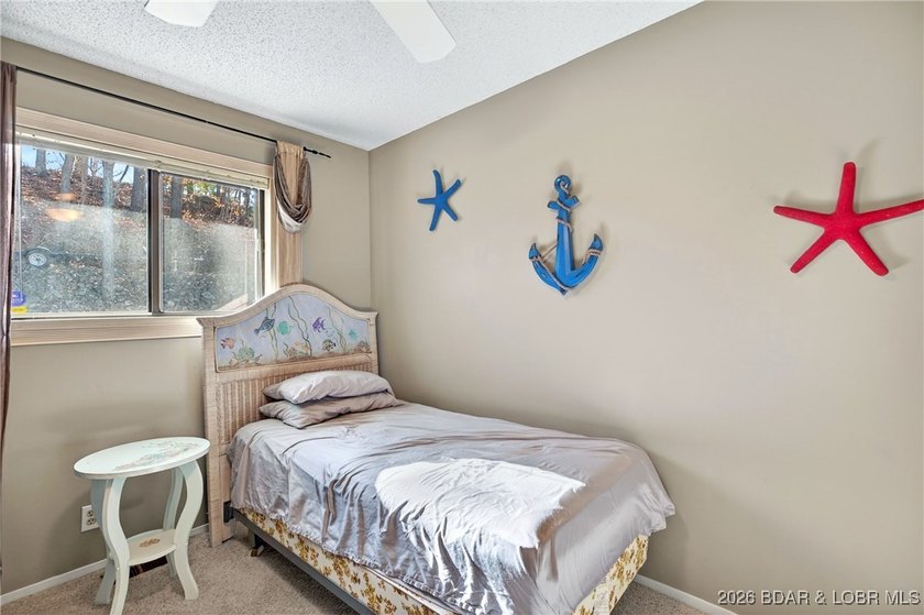 Lake life doesn't get easier-or cozier-than this. This two-story - photo 14