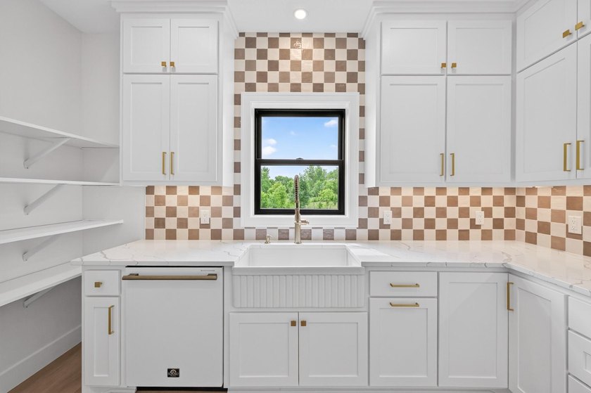 Experience luxury living in this custom-built two-story home by - photo 13