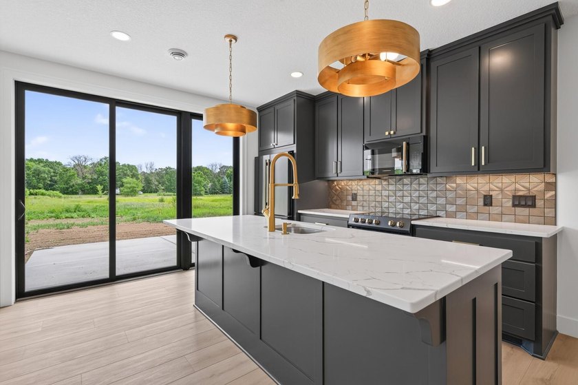 Experience luxury living in this custom-built two-story home by - photo 34