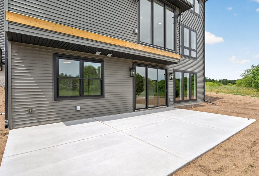 Experience luxury living in this custom-built two-story home by - photo 42