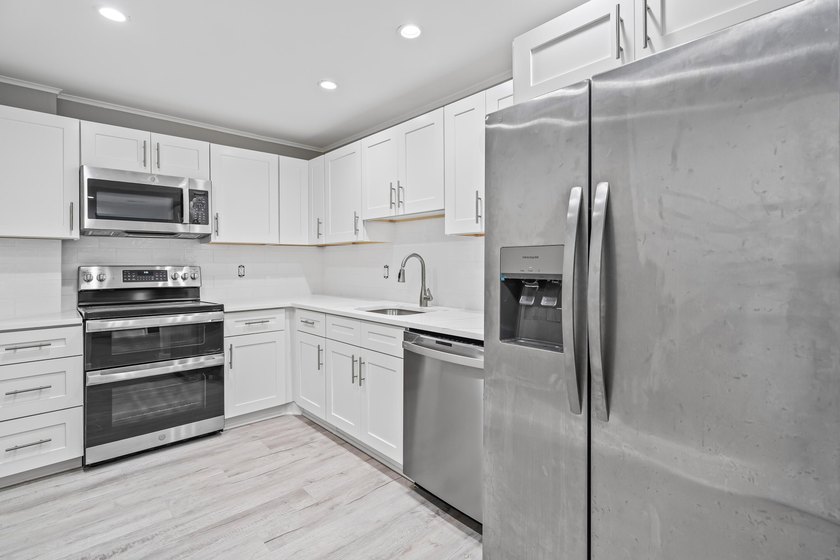 Welcome Home! This beautifully renovated, oversized condo is - photo 5