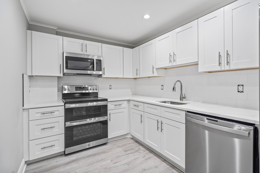 Welcome Home! This beautifully renovated, oversized condo is - photo 6