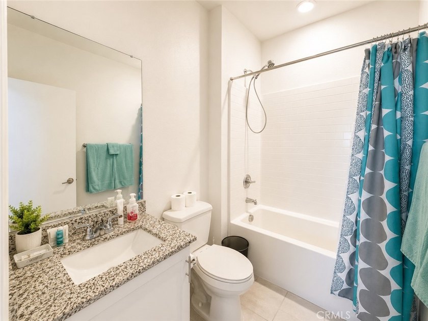 PRICE TO SELL WITH TONS OF UPGRADES! Experience modern living in - photo 8