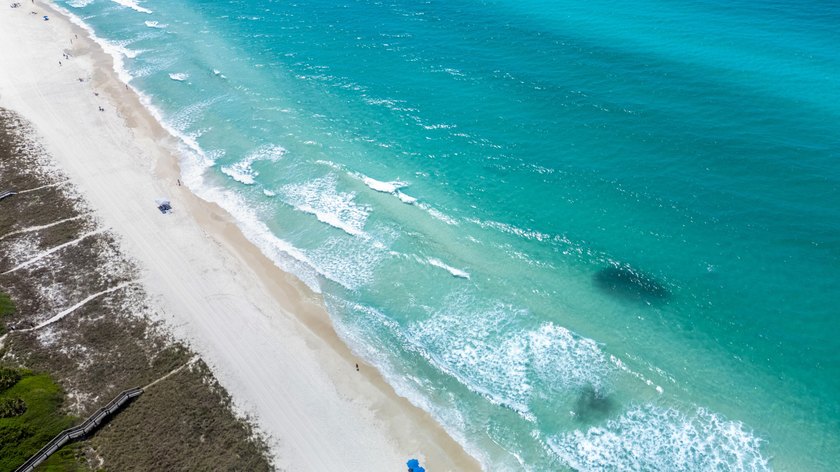 There is a certain energy to this stretch of Inlet Beach, where - photo 44