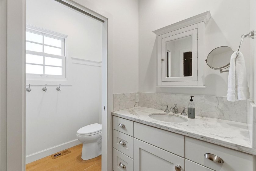 Experience refined coastal living in this fully remodeled beach - photo 12