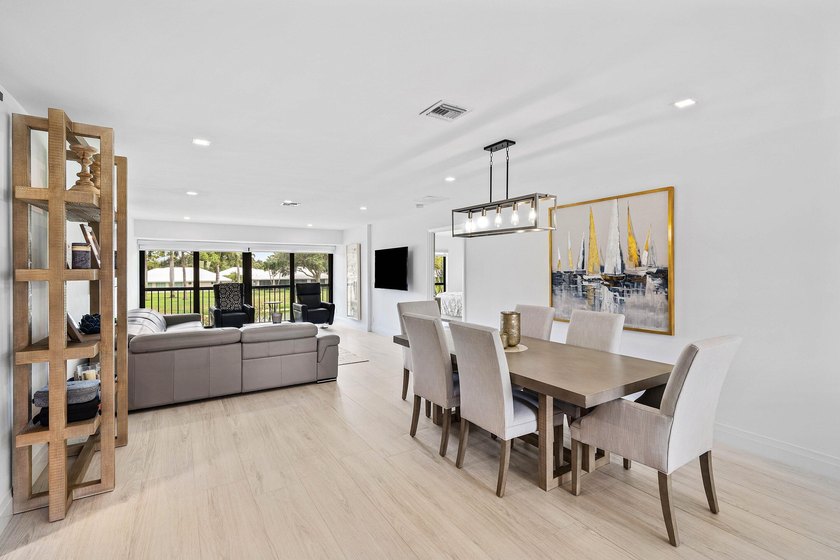 Enjoy tranquil lake views from this beautifully renovated &amp; - photo 3