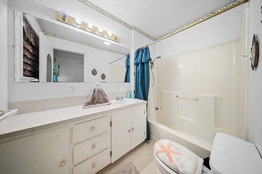 Escape to this charming 3-bedroom, 2-bath lake house nestled in - photo 13