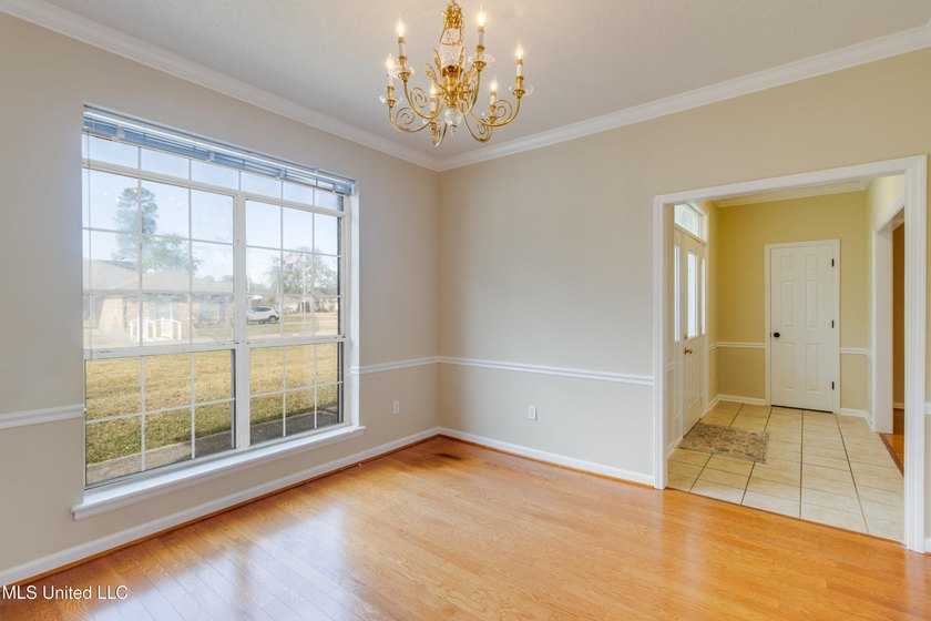 Freshly painted throughout, this inviting brick home offers - photo 5
