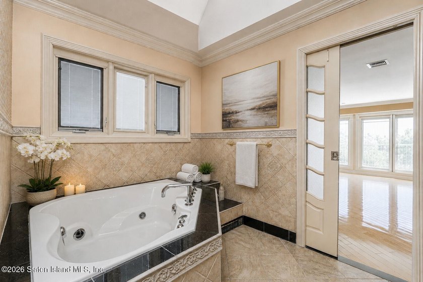 Perched above the water in S.E. Annadale, 133 Ryan Place doesn't - photo 23
