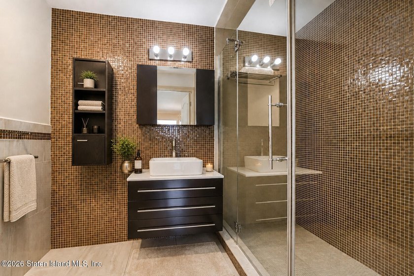 Perched above the water in S.E. Annadale, 133 Ryan Place doesn't - photo 28