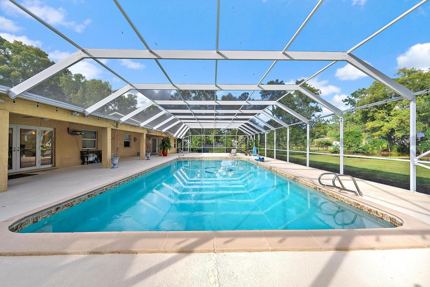 Back on the Market! NEW ROOF!Jupiter Farms Acre+ Retreat with - photo 3