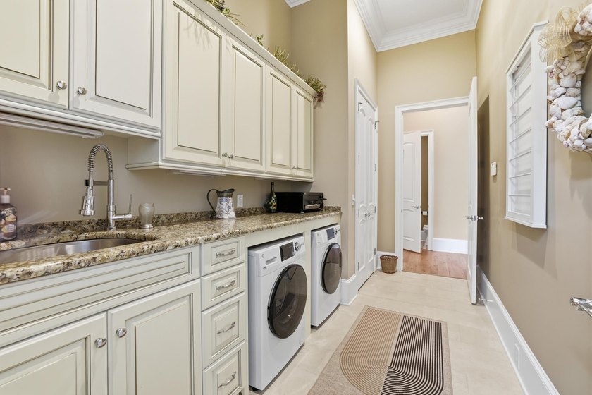 Set on the 11th fairway of The Reserve, 681 Reserve Drive is an - photo 27