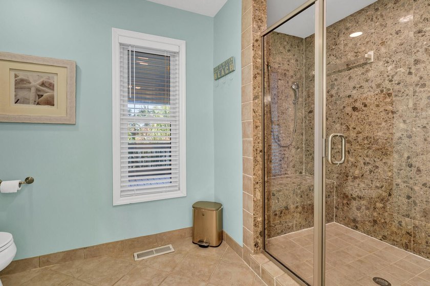 Custom designed 3 Br., 2.5 Ba. resort home is privately tucked - photo 31