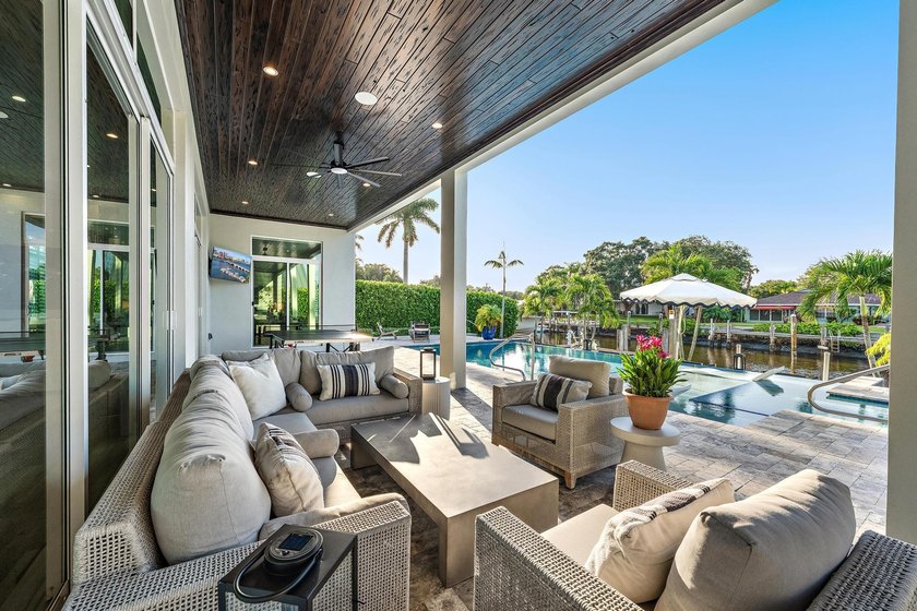 A statement of modern waterfront luxury, this extraordinary - photo 16