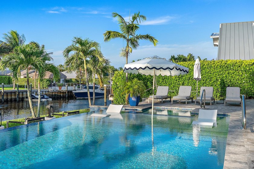 A statement of modern waterfront luxury, this extraordinary - photo 23
