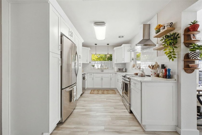 Coastal charm and exceptional curb appeal define this - photo 11