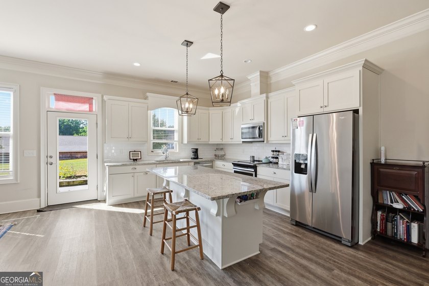 Welcome to this spacious 4 bedroom, 3 bath home in the highly - photo 13