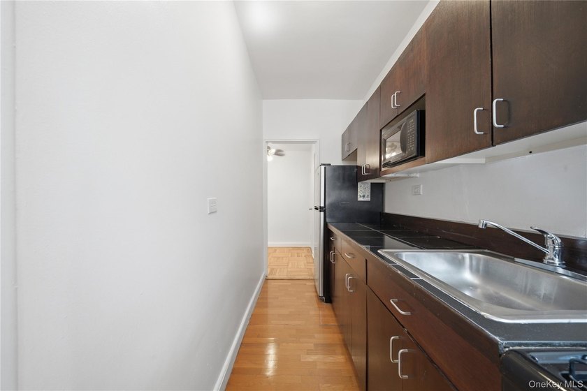 Welcome to this move-in-ready garden-level studio co-op at - photo 15