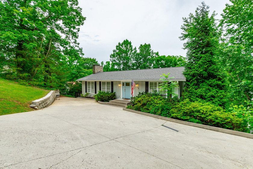 Welcome to 1043 Clift Cave Drive, where breathtaking waterfront - photo 5