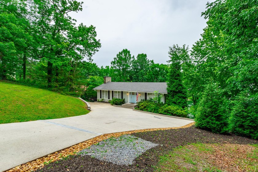 Welcome to 1043 Clift Cave Drive, where breathtaking waterfront - photo 6