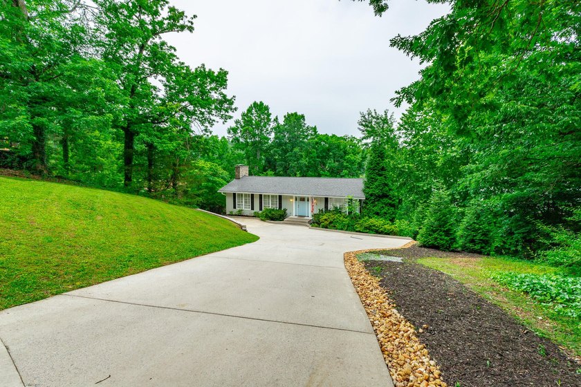 Welcome to 1043 Clift Cave Drive, where breathtaking waterfront - photo 7