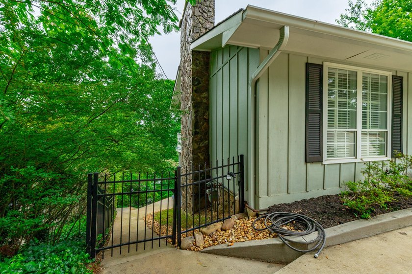 Welcome to 1043 Clift Cave Drive, where breathtaking waterfront - photo 9