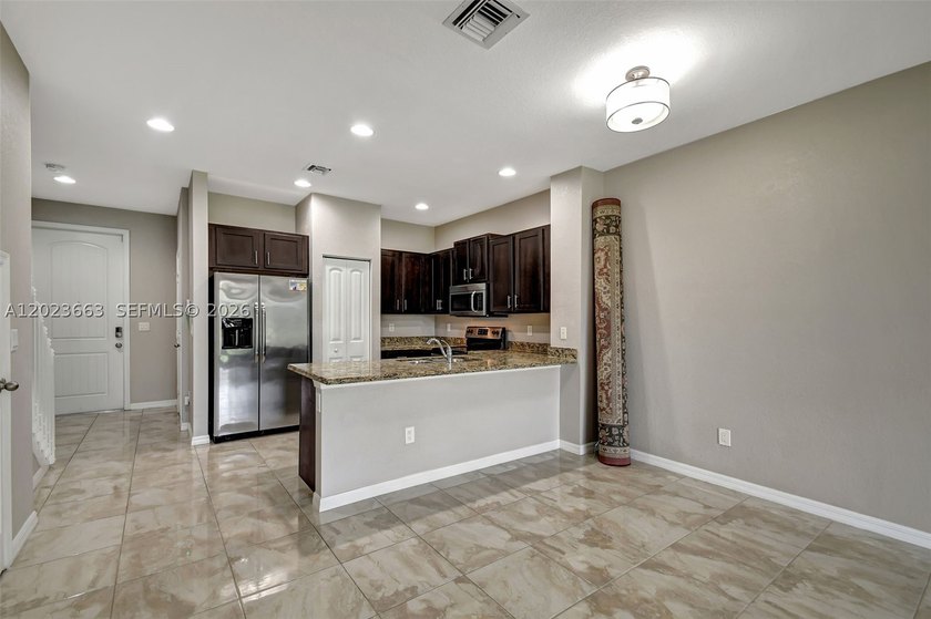 Newer construction townhome with serene water views. Gated - photo 11