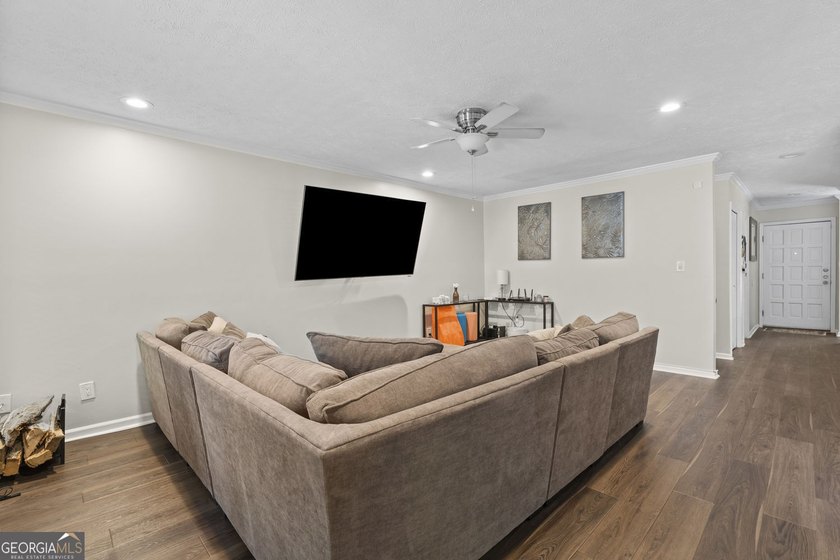 Welcome to this inviting end-unit townhome nestled in the highly - photo 12