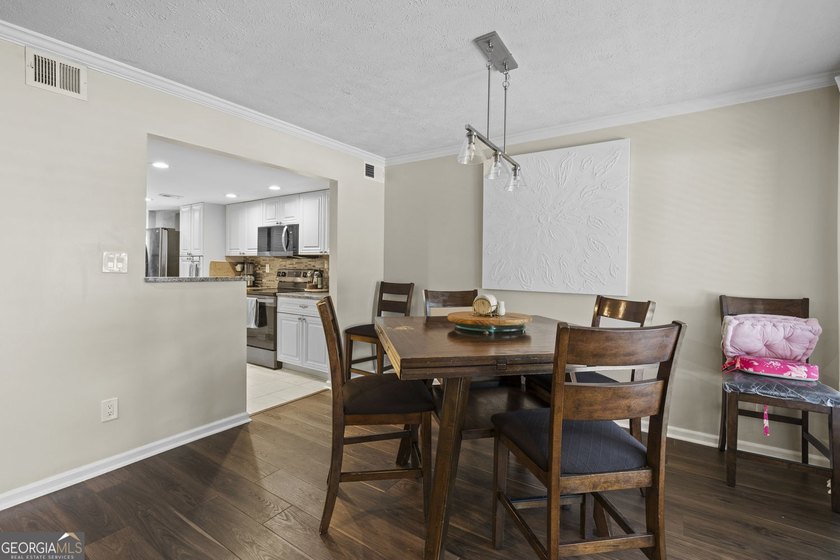 Welcome to this inviting end-unit townhome nestled in the highly - photo 15