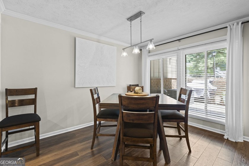 Welcome to this inviting end-unit townhome nestled in the highly - photo 16